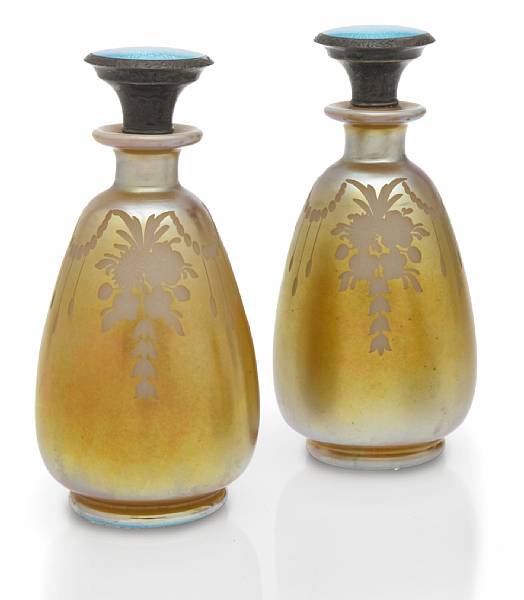 Appraisal: A pair of Steuben Aurene on calcite engraved glass perfume