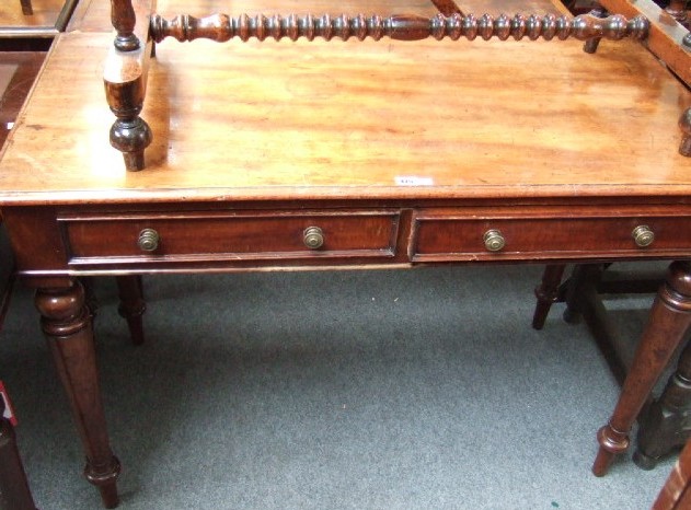 Appraisal: A Victorian mahogany side table the rectangular top over a