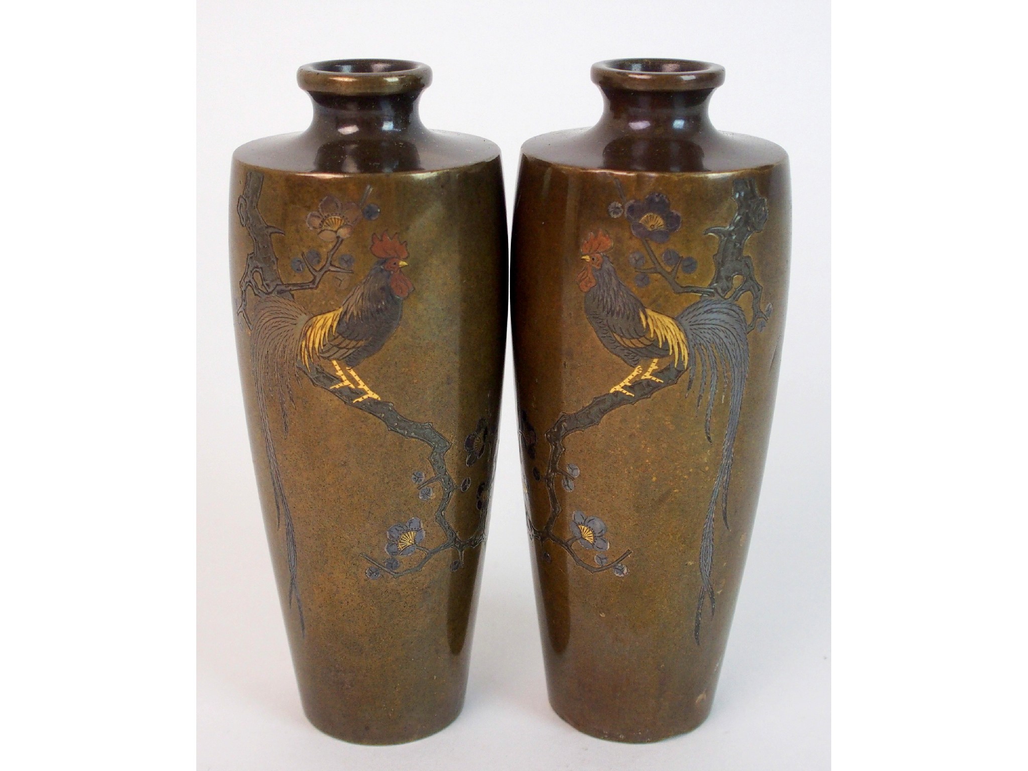 Appraisal: A pair of Japanese bronze baluster vasesdecorated with cockerels on