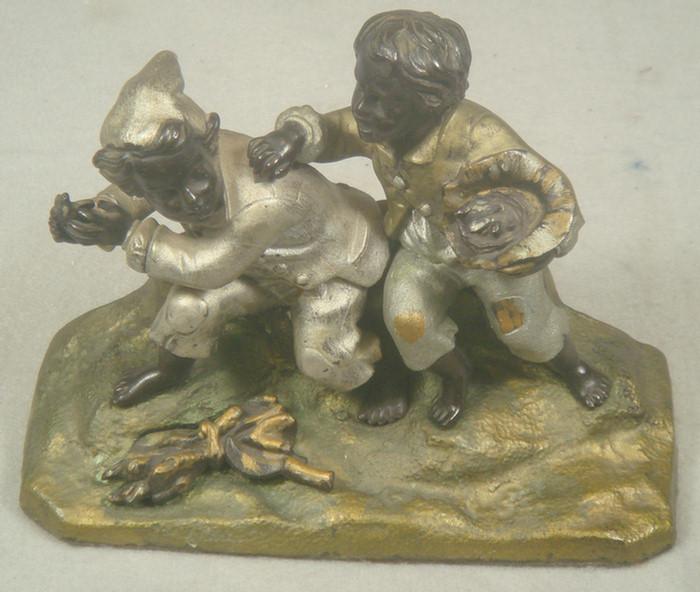 Appraisal: Cast iron doorstop two barefoot children playing painted with multi