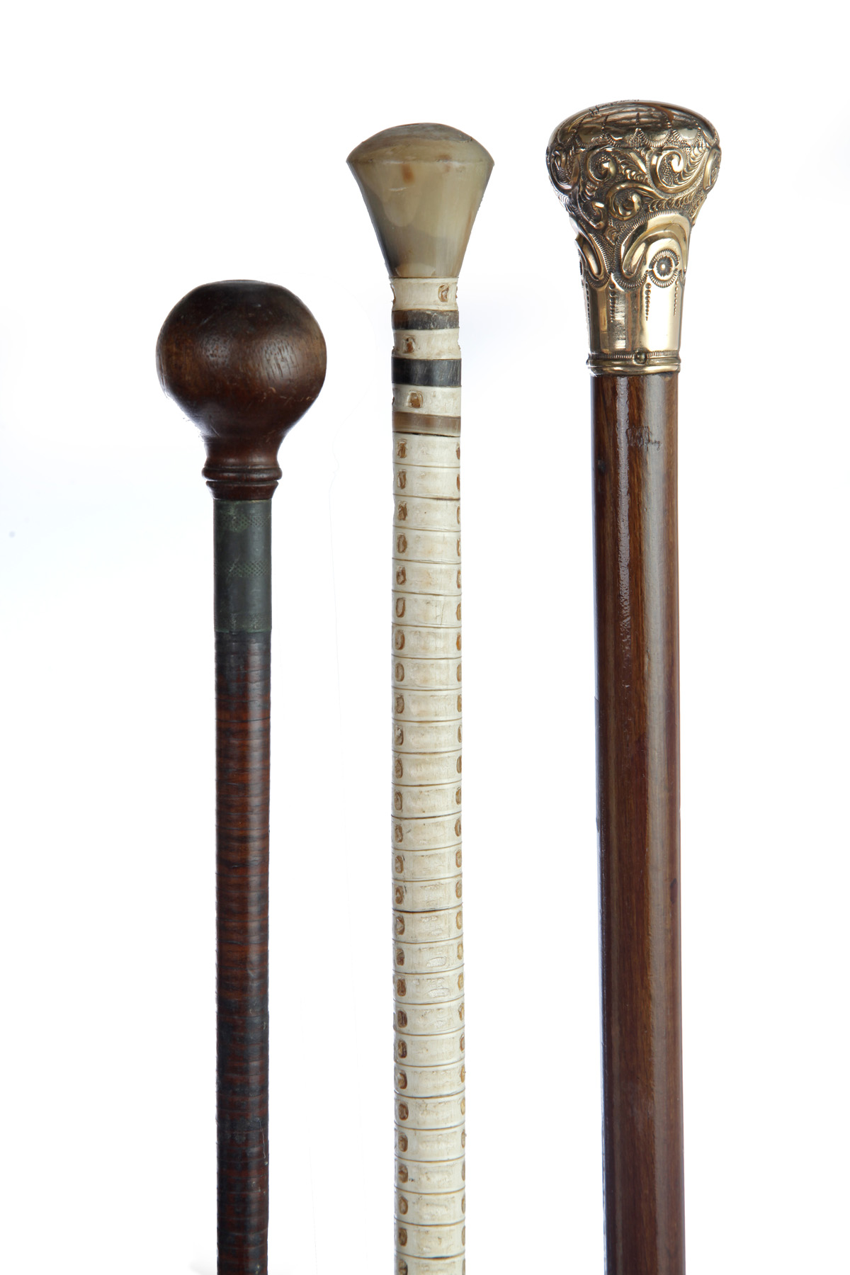 Appraisal: THREE WALKING STICKS American late th century Gold filled handle