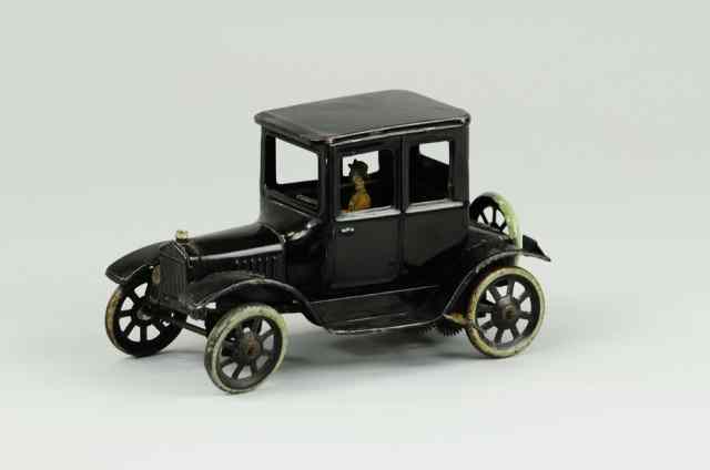 Appraisal: BING FORD COUPE Germany black tin coupe with seated man