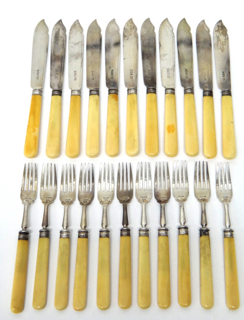 Appraisal: Eleven silver bladed fish knives with ivory handles Sheffield seven