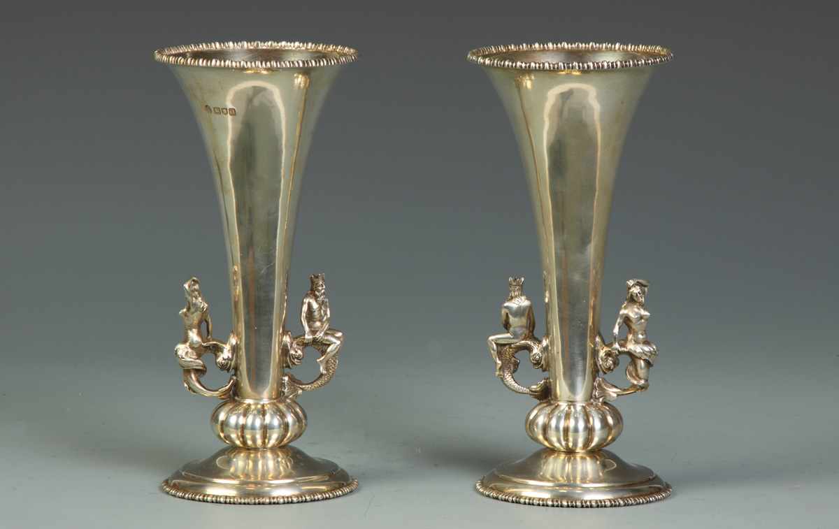 Appraisal: Pair of Sterling Vases w Neptune riding on Stylized Fish