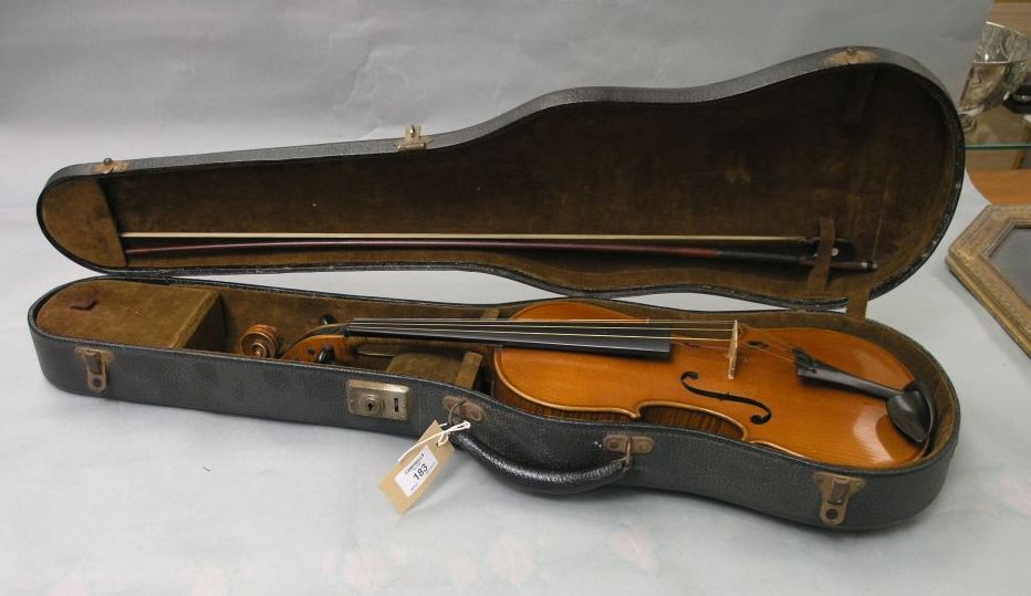 Appraisal: A violin in half-veneered back unsigned complete with bow in