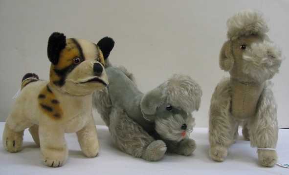 Appraisal: A GROUP OF THREE GERMAN STEIFF MOHAIR DOGS Two are