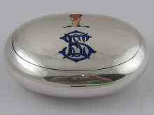 Appraisal: A oval tobacco box decorated with an enamel coat of