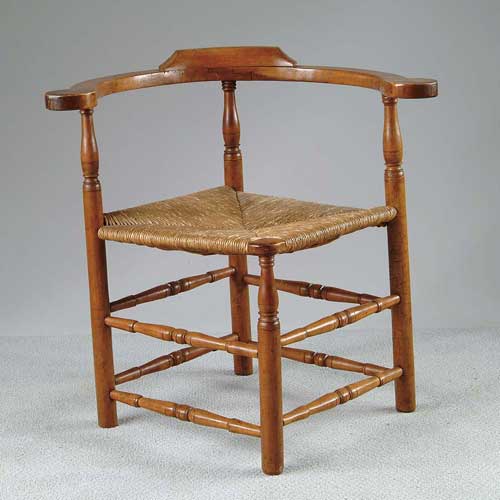 Appraisal: ANTIQUE COUNTRY RUSH SEAT CORNER CHAIR Turned double box stretcher