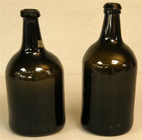 Appraisal: Two green glass straight sided bottles th century each approximately