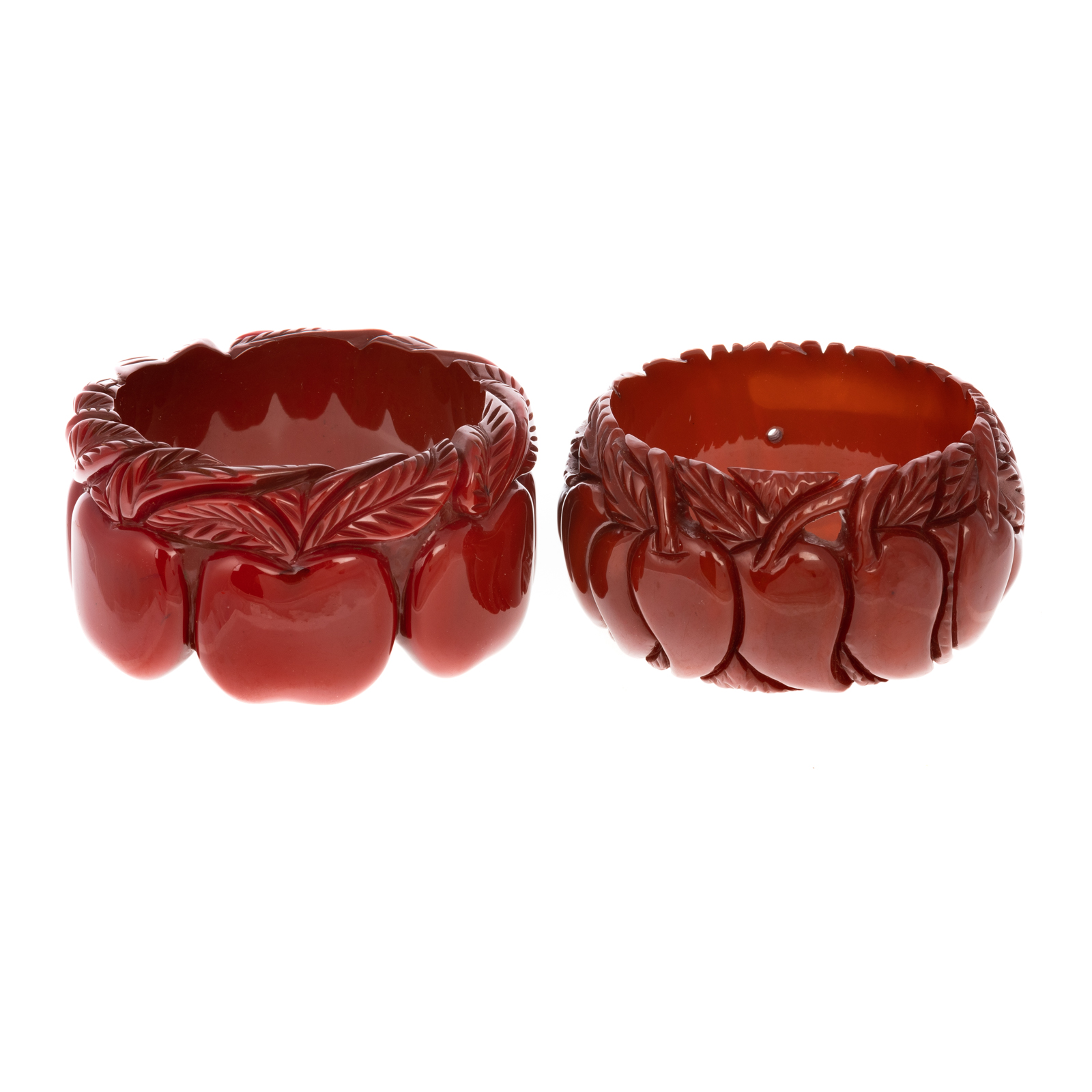 Appraisal: A CARVED APPLE CHILI PEPPER BAKELITE BANGLES Apple motif carved