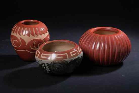 Appraisal: THREE SANTA CLARA PUEBLO REDWARE POTS Including one melon form