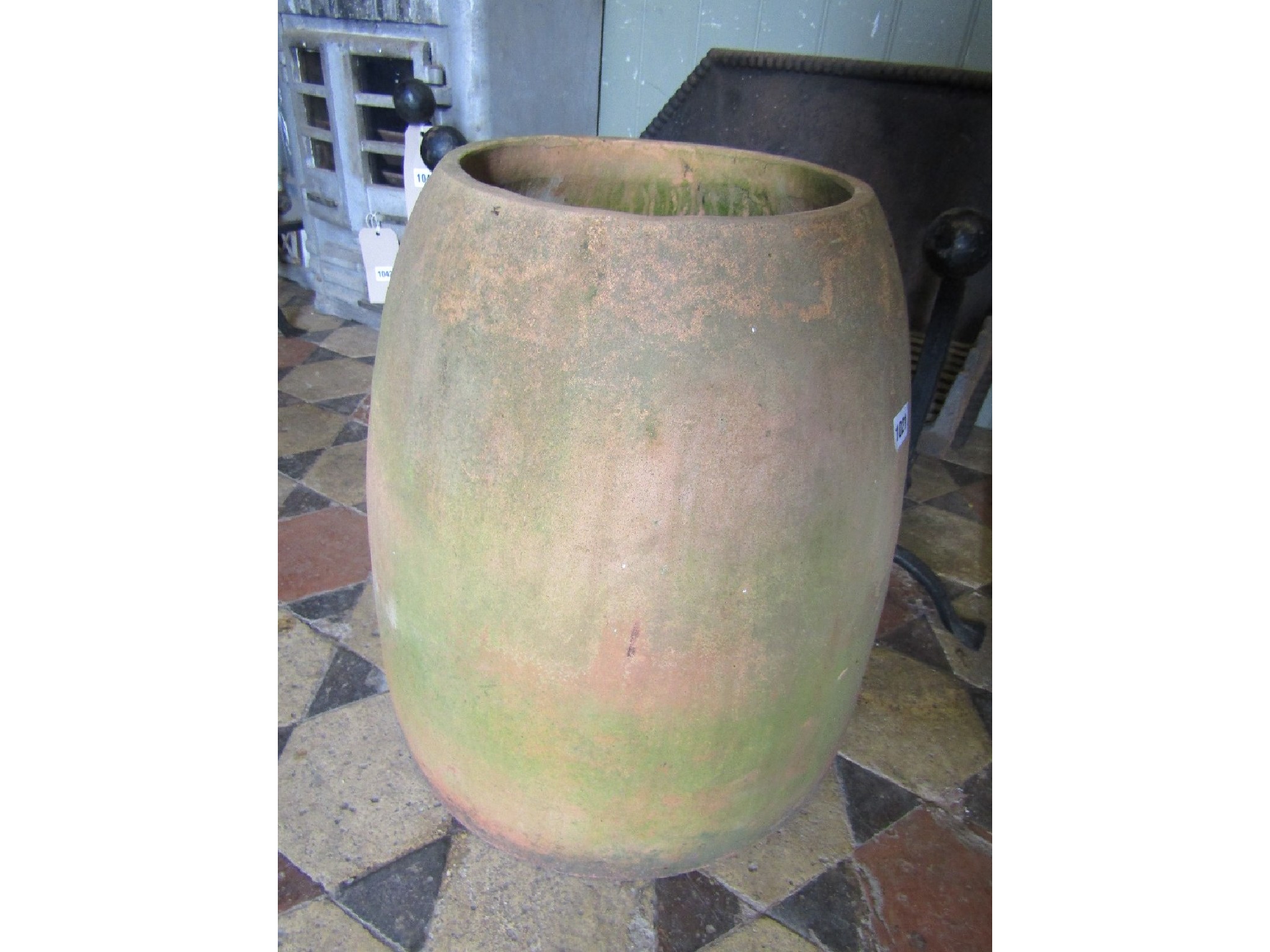 Appraisal: A weathered contemporary bell shaped rhubarb forcer and domed cap