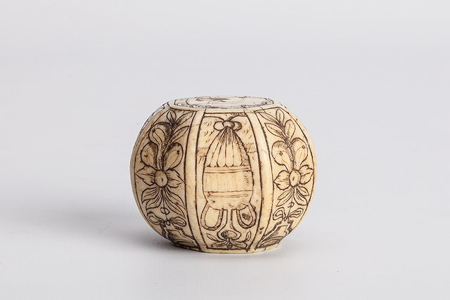 Appraisal: A MIDDLE EASTERN CARVED IVORY PISTOL POMMEL of eight sided