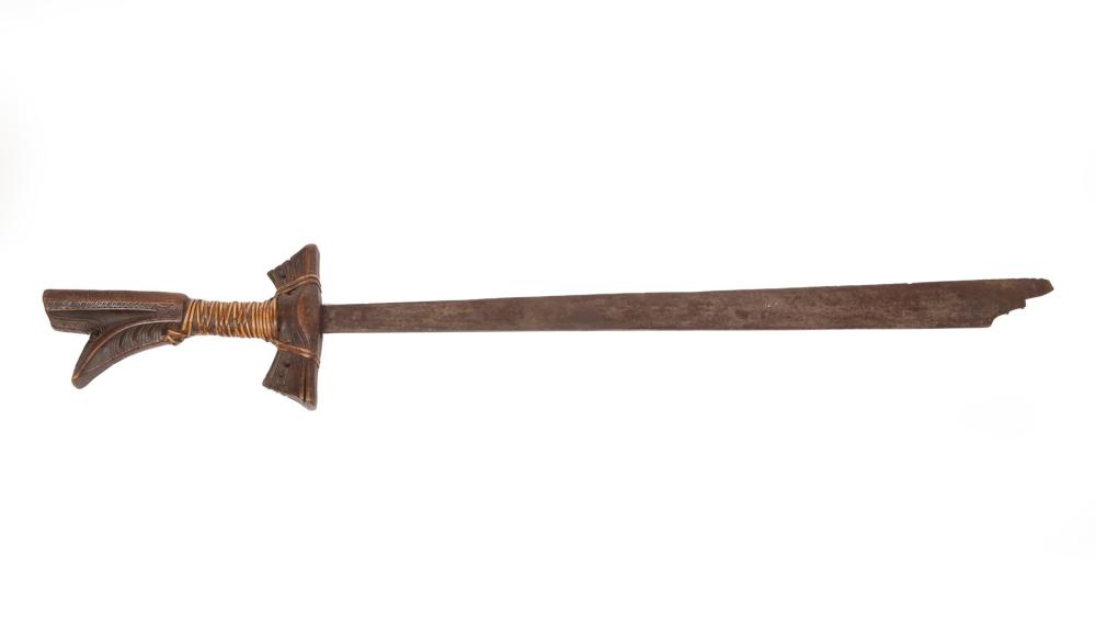 Appraisal: Indigenous Carved Wood and Metal Sword carved geometric designs to