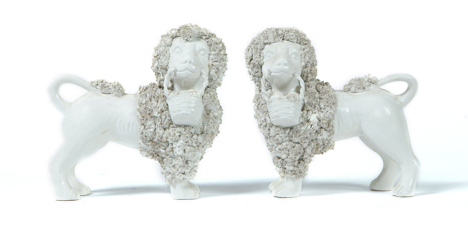 Appraisal: PAIR OF PARIAN POODLES American ca Each has a basket