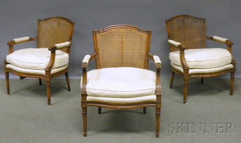 Appraisal: Set of Three Louis XVI-style Upholstered and Caned Carved Walnut