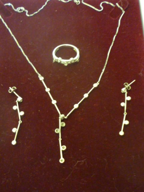 Appraisal: A DIAMOND NECKLACE ring and earrings set each having a