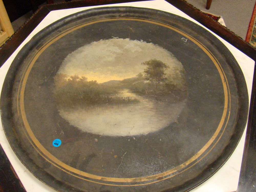 Appraisal: CIRCULAR PAINTED TOLEWARE TRAY th CenturyIn black and gold with