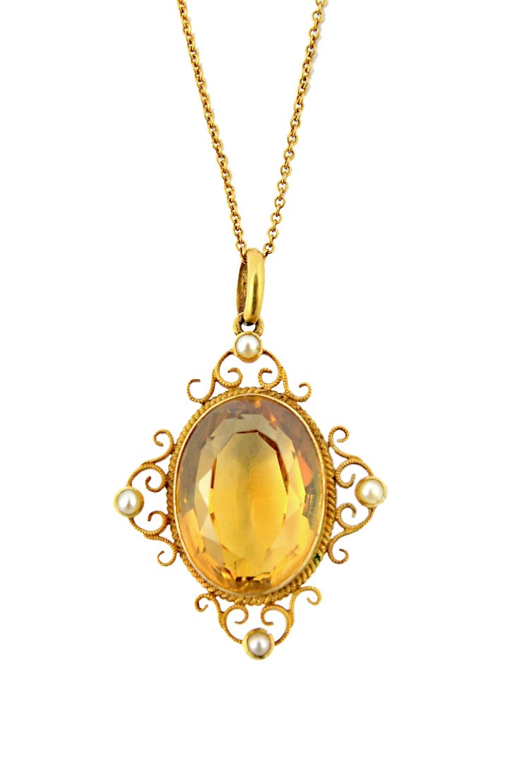 Appraisal: A gold citrine and half pearl set pendant mounted with