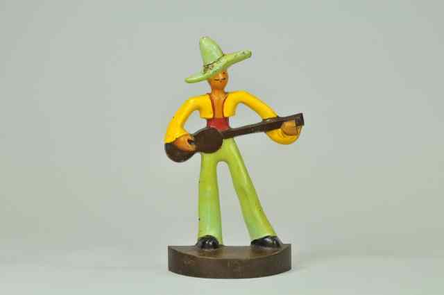 Appraisal: MEXICAN WITH GUITAR DOORSTOP BOOK EXAMPLE Littco Products '' ''