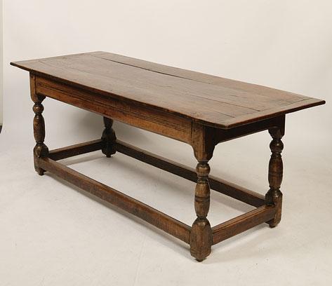 Appraisal: A CHARLES II STYLE OAK REFECTORY TABLE the plank construction