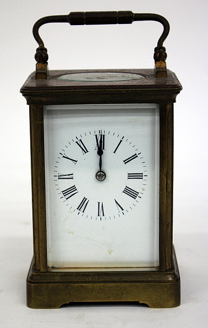 Appraisal: A FRENCH CARRIAGE CLOCK the enamelled dial with Roman numerals