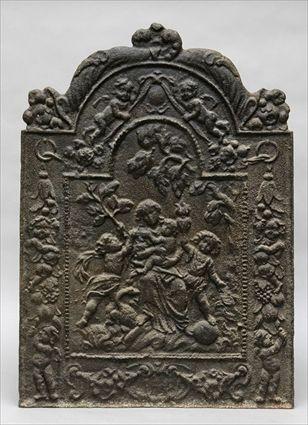 Appraisal: CAST IRON FIREBACK The panel depicting Virgin Child and attendants