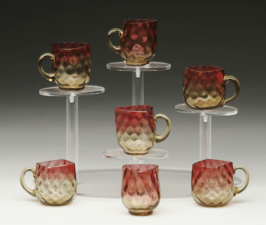 Appraisal: SEVEN AMBERINA CUPS Very unusual small cups are either triangular