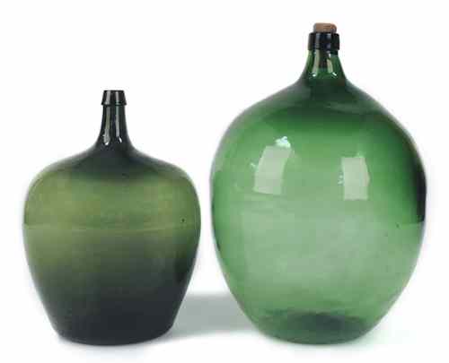 Appraisal: Two green glass demi-john bottles tallest -