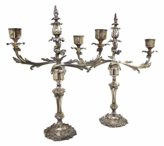 Appraisal: A Pair of Sheffield Plate Two-Light Candelabra having a baluster