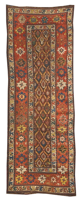 Appraisal: A NORTH WEST PERSIAN RUST GROUND RUNNER decorated polychrome stylistic