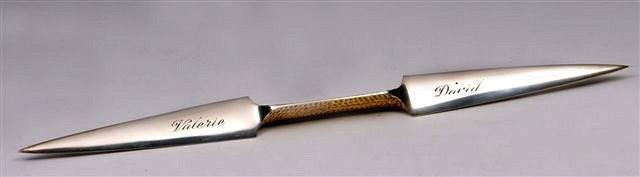 Appraisal: A SILVER DOUBLE BLADED PAPER KNIFE with textured gilt handle