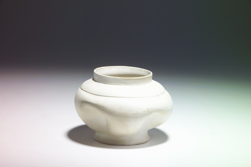 Appraisal: GEORGE OHR Bisque-fired dimpled vessel of white clay Small chip