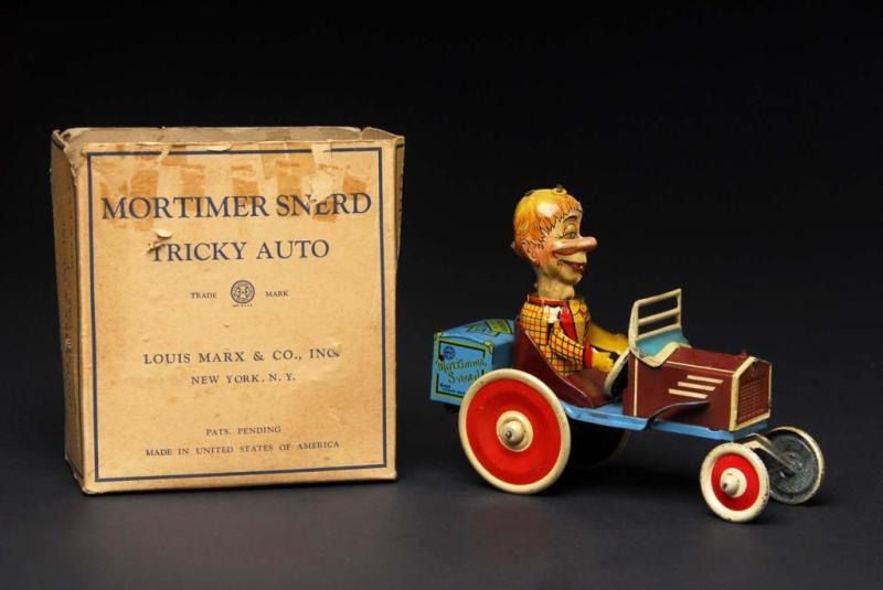 Appraisal: Tin Marx Mortimer Snerd Tricky Auto Toy Description American Working