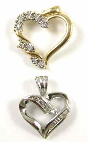 Appraisal: TWO DIAMOND HEART SHAPED PENDANTS one a k yellow gold