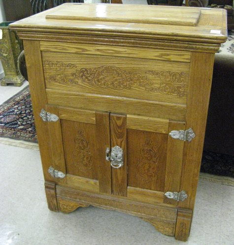 Appraisal: TWO-DOOR ASHWOOD ICEBOX American c having a rectangular lift top