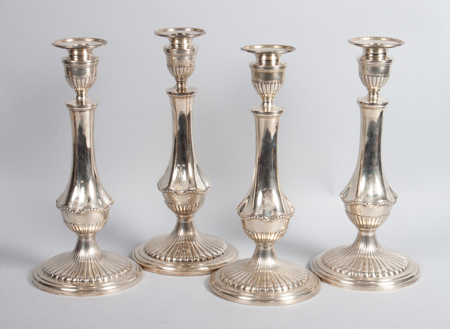 Appraisal: Set of four Gorham weighted-sterling candlesticks dated and marked Sutherland