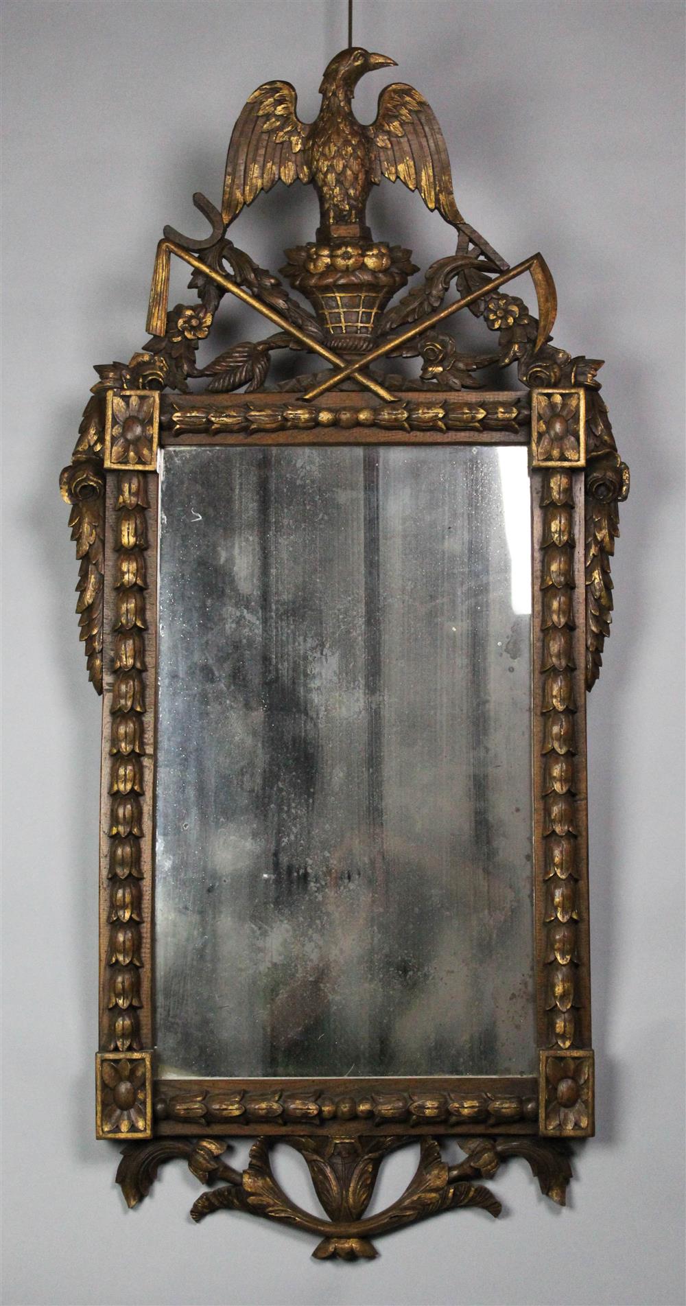 Appraisal: NEOCLASSICAL STYLE PARCEL GILT OAK MIRROR with eagle and basket