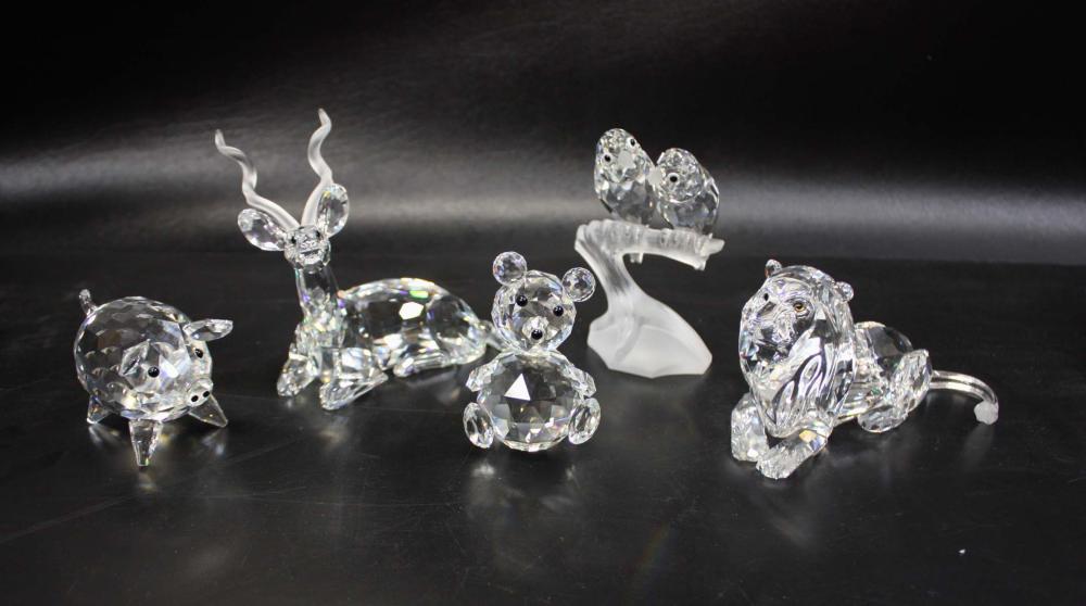 Appraisal: FIVE CRYSTAL SWAROVSKI FIGURINES Kudu Lion Lovebirds Pig and Teddy