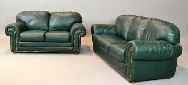 Appraisal: A Green Leather Sofa Matching LoveseatBoth sofa and loveseat have