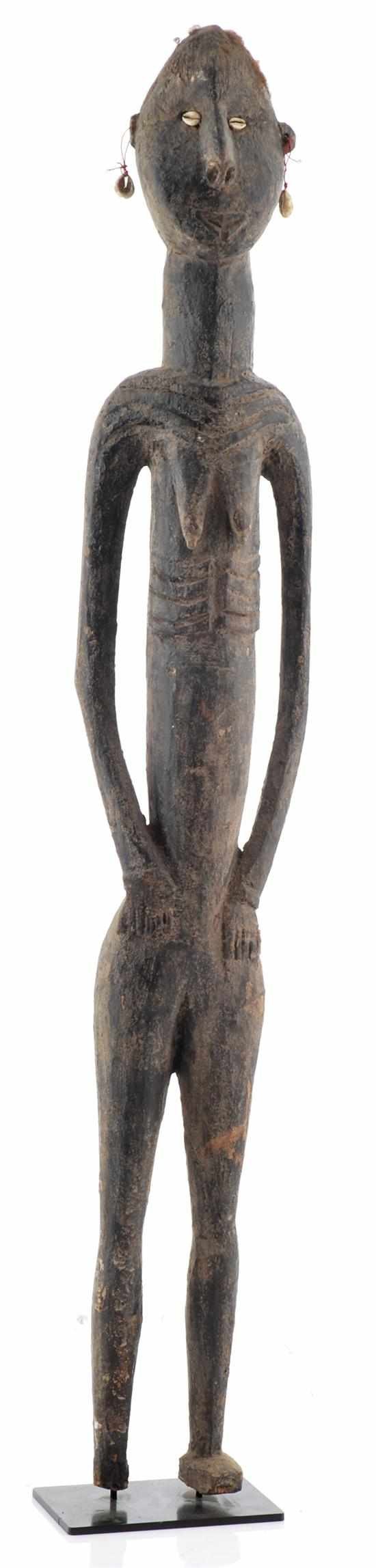 Appraisal: UNUSUAL NOGWI FEMALE FIGURE with remnant human hair early to