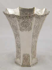 Appraisal: An Iranian silver curve tapering panelled vase ht cm approx