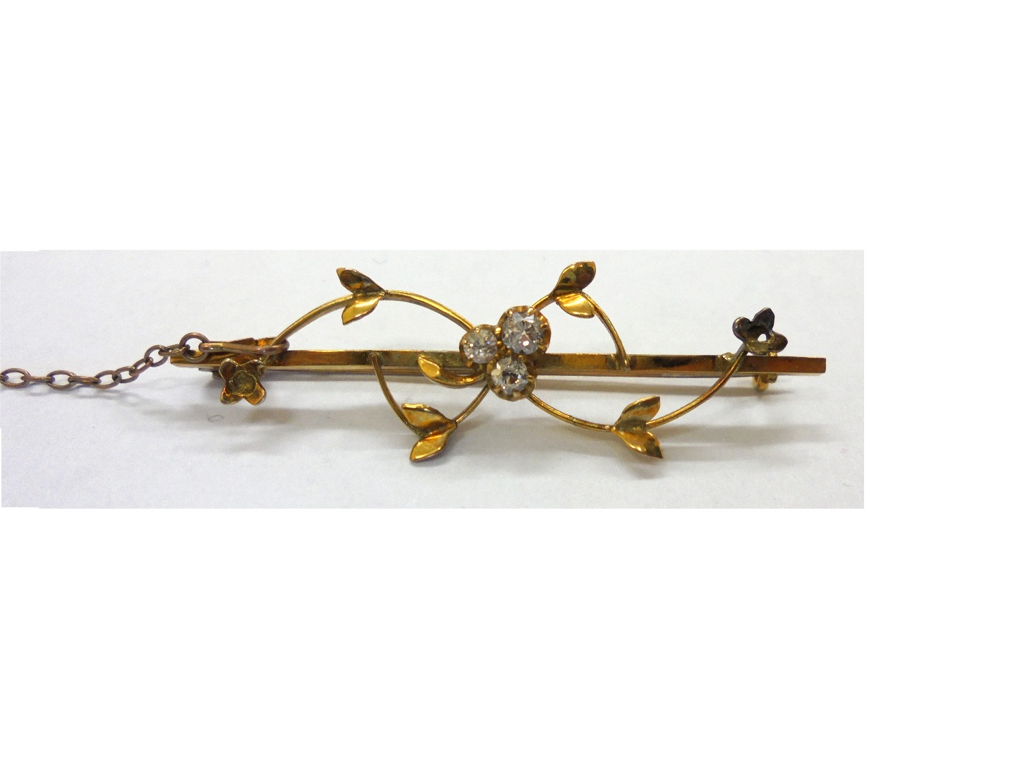 Appraisal: An Edwardian gold and diamond three stone bar brooch in