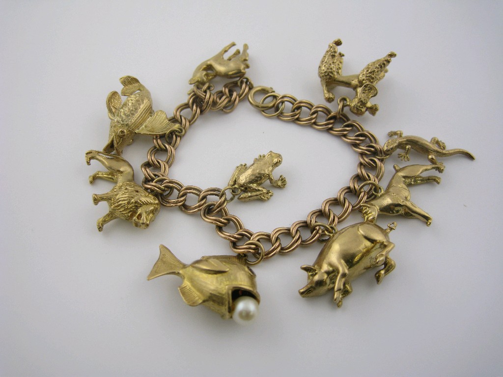 Appraisal: A ct gold double curb-link Bracelet with nine various animal