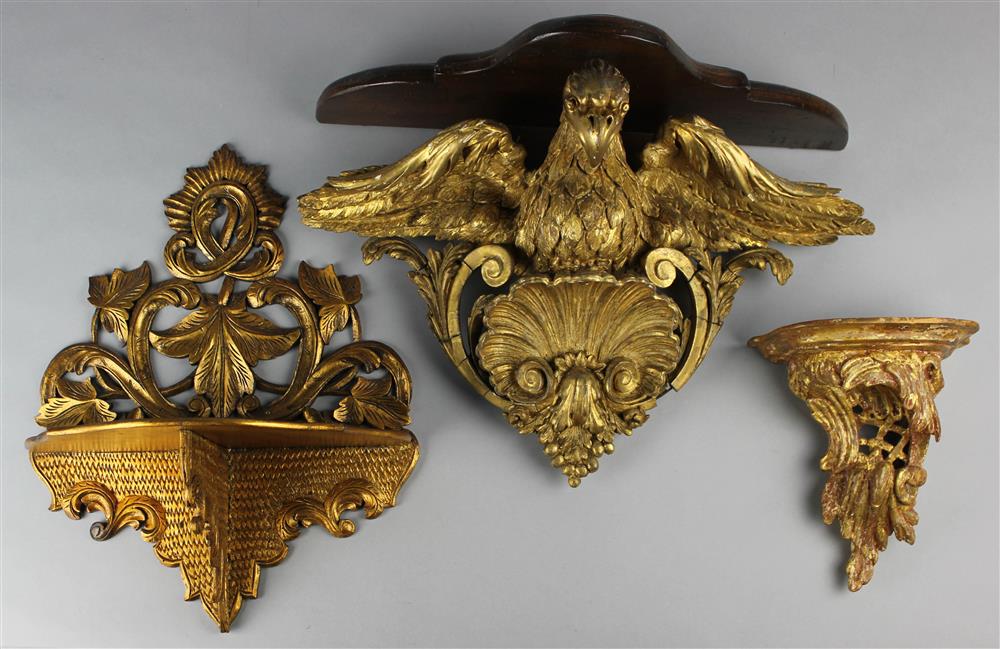 Appraisal: THREE GILT WALL BRACKETS one with a displaying eagle -