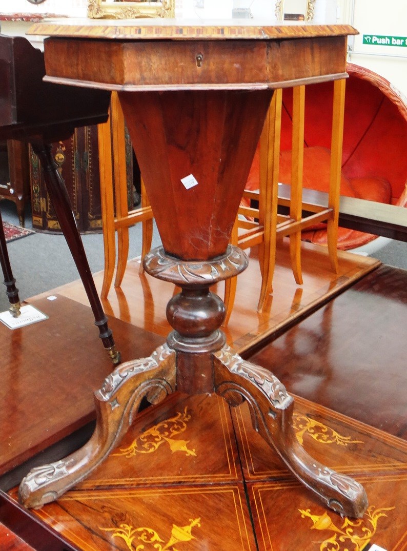 Appraisal: A Victorian figured walnut octagonal trumpet shaped work table on