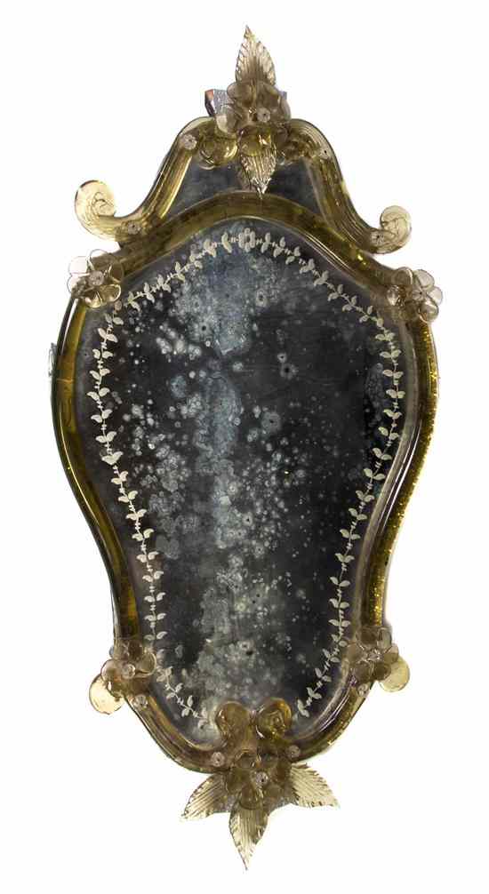 Appraisal: A Venetian Glass Mirror having a floral and scrolled cornice