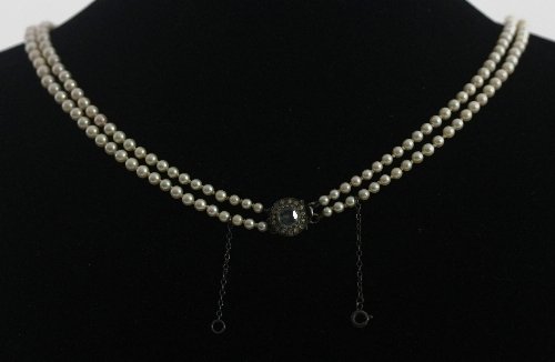 Appraisal: A double-strand cultured pearl necklace with aquamarine and diamond cluster