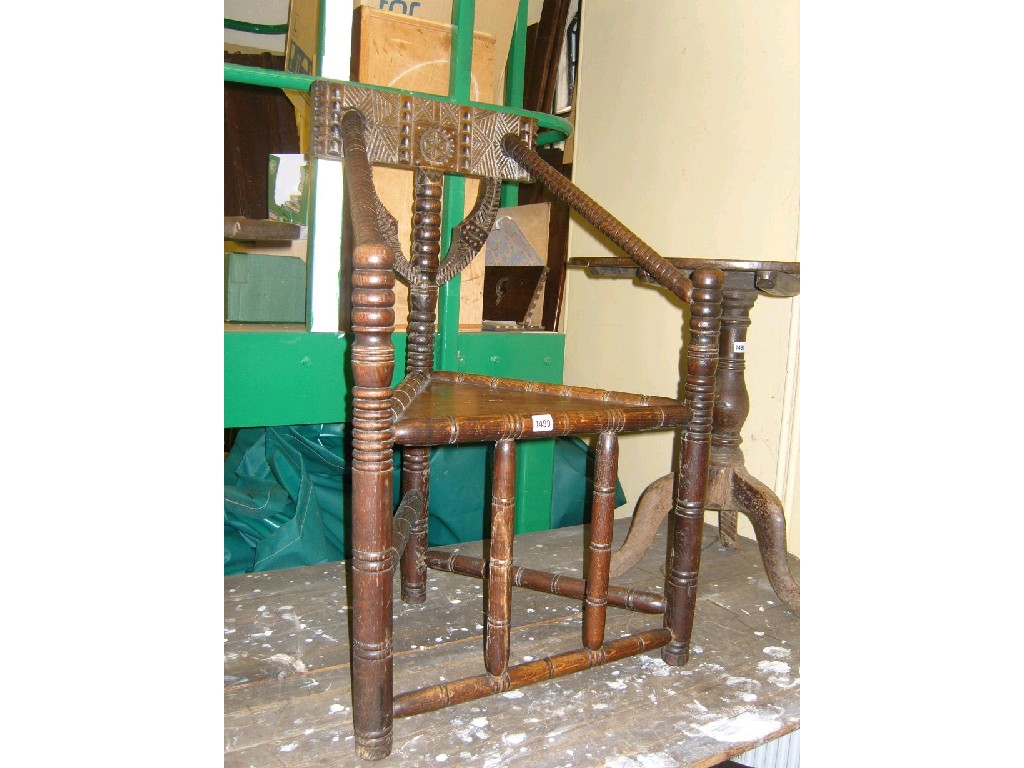 Appraisal: A th century oak turners chair with ring and bobbin