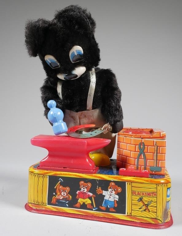 Appraisal: Made in Japan A battery operated Blacksmith Bear animated toy